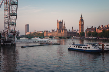 River Thames landmarks: Palace of Westminster and the London Eye.
