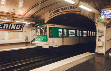Train arriving at Solférino Metro station.