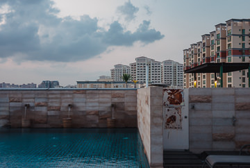 Rooftop pool and suburb skyline.