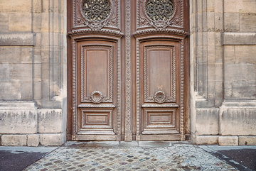 Door on the exterior of the Louvre on Rue de Rivoli.