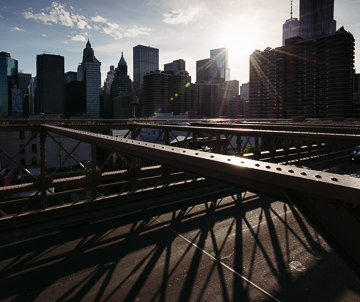 Brooklyn Bridge, skyscrapers, and shadows.