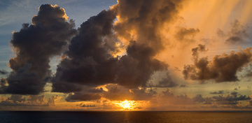 Indian Ocean sunset behind an impressive, golden, cloudscape.